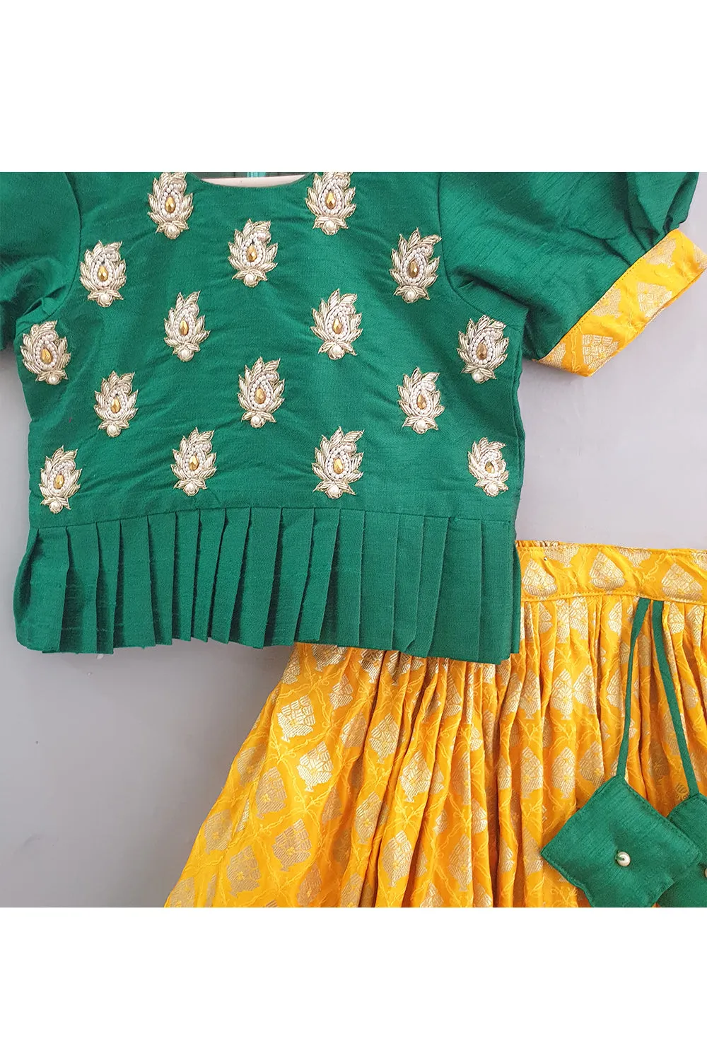 Bottle green hand embroidered peplum choli with banarasi lehenga